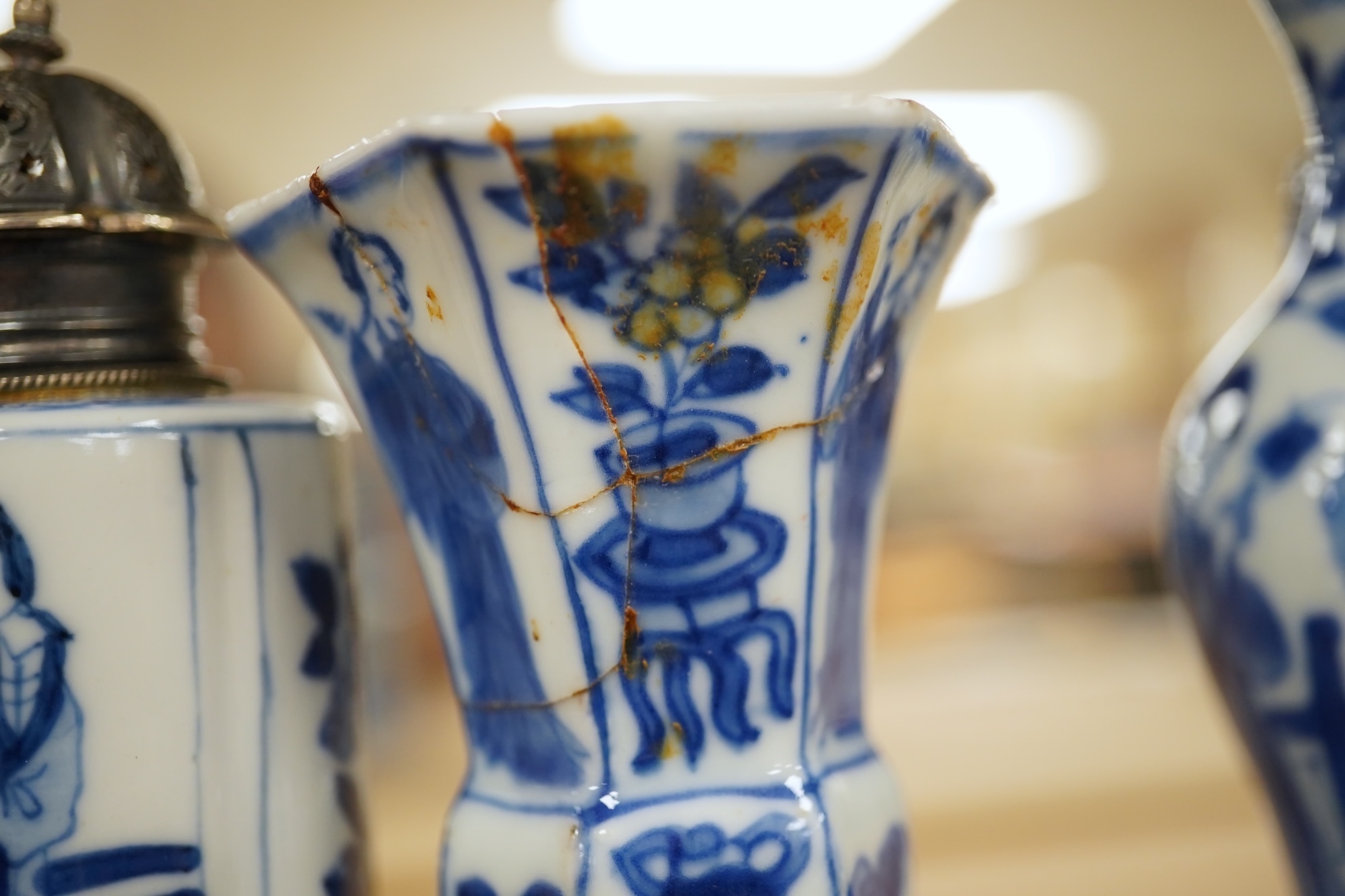 Five Chinese blue and white small vases, Kangxi period, one Dutch silver mounted as a sugar castor, tallest 11cm. Condition - varies